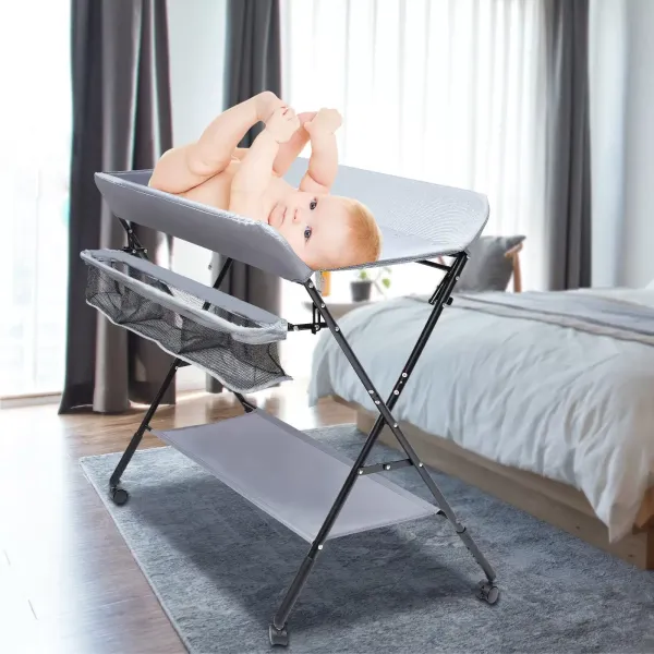 Cambiador plegable y portátil, con cesta de almacenamiento lateral equipada con ruedas antideslizantes para bebés de hasta 12 meses